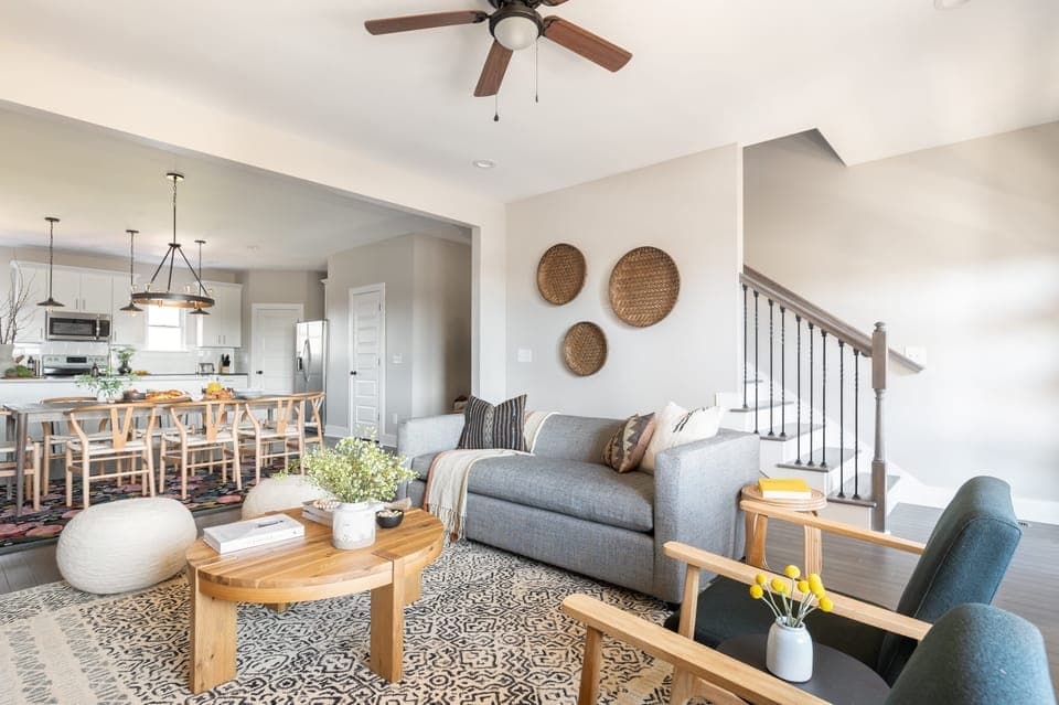 Living room is airy and comforting.