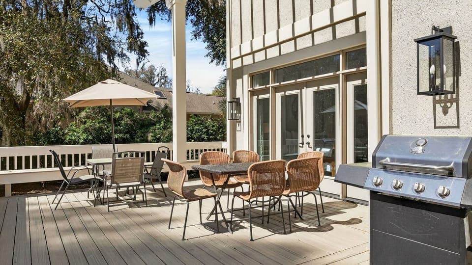 Large deck with BBQ grill and al fresco dining table perfect for outdoor fun.