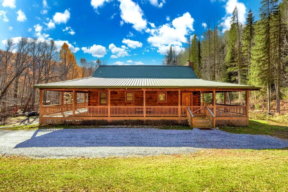 A picturesque pond welcomes you to this serene driveway.