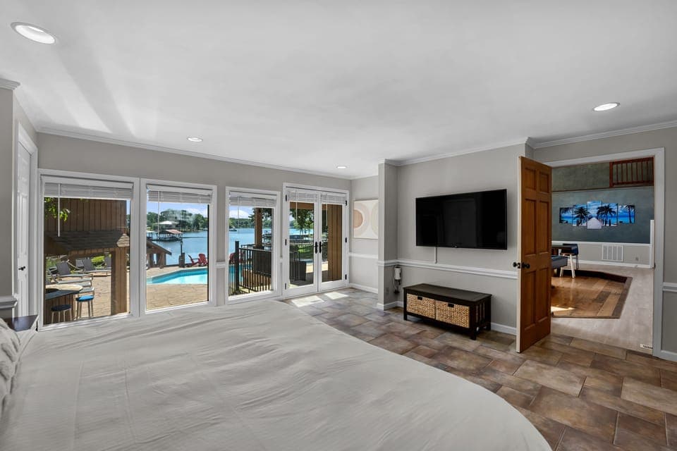 Master Bedroom - main level - king bed, amazing views of the lake &amp; full attached bathroom.