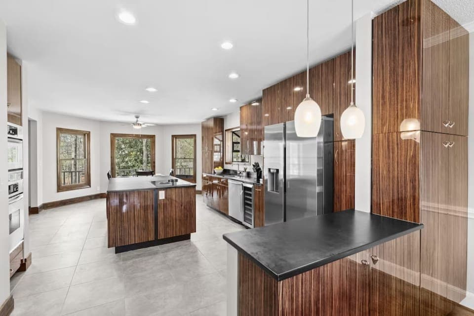 Efficiency and elegance coexist in our modern-wood fusion kitchen.