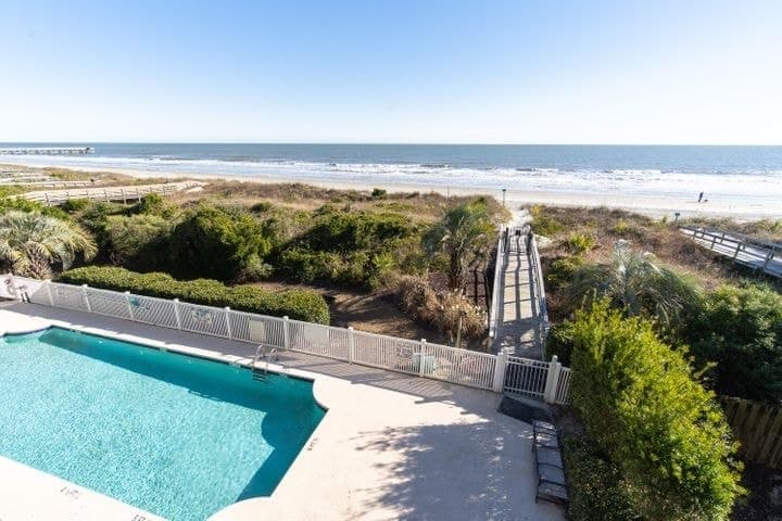 Our community pool meets the endless horizon of the oceanfront.