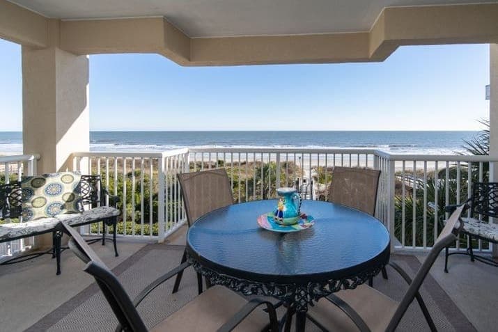 Sipping coffee, savoring the ocean view from the balcony.