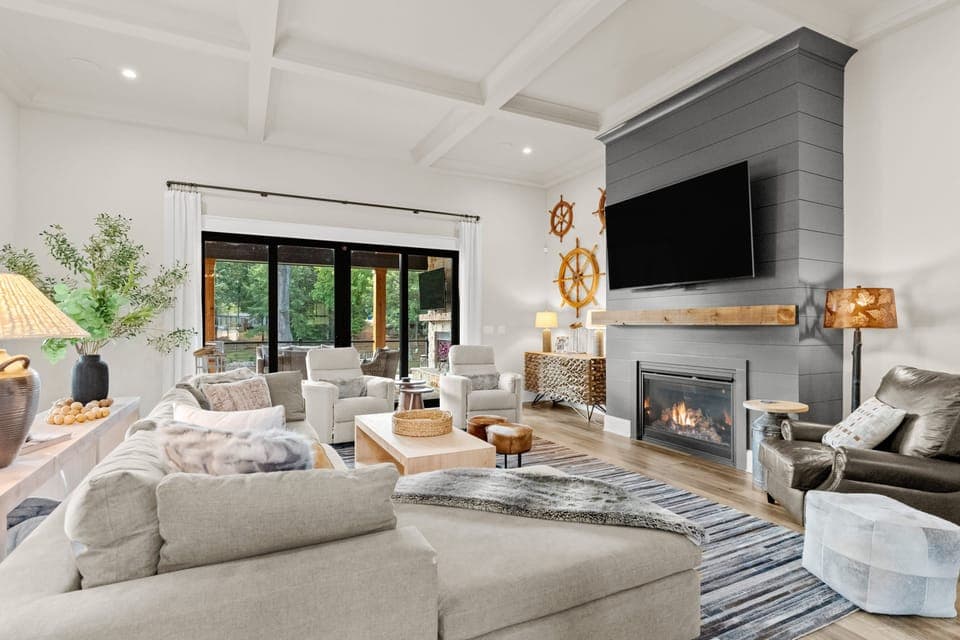 Inviting living room with large, comfy sectional, TV, plus sliders to the porch!