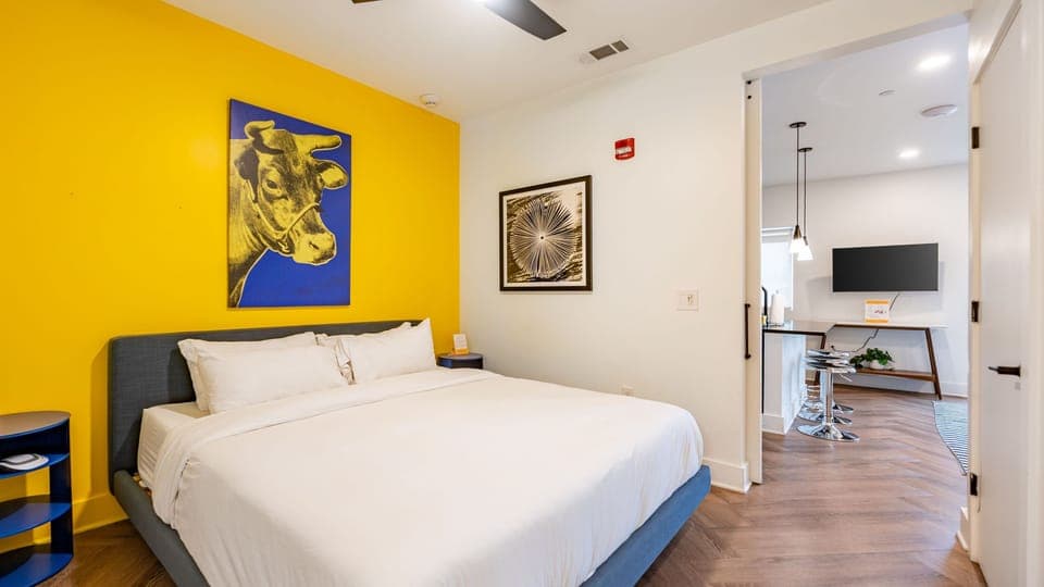 The bedroom features a king bed and an ensuite bathroom.
