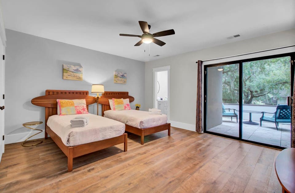 Bedroom 3 features two twin beds, an ensuite bathroom, and a patio.