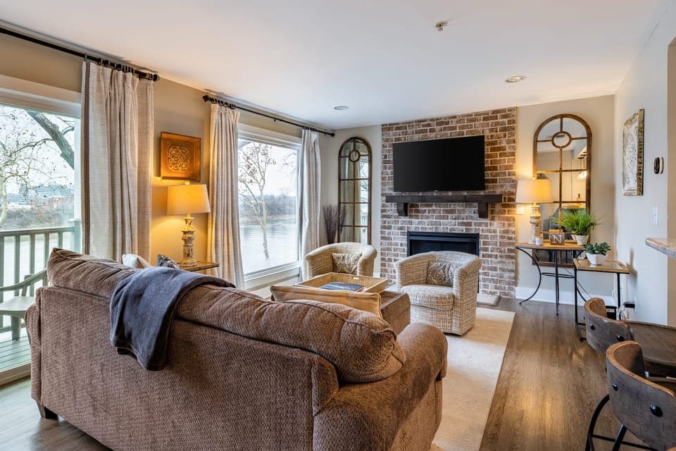 Spacious yet cozy living room with a TV and fireplace.