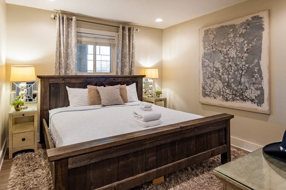 Primary bedroom features a king bed, TV, and ensuite bathroom.