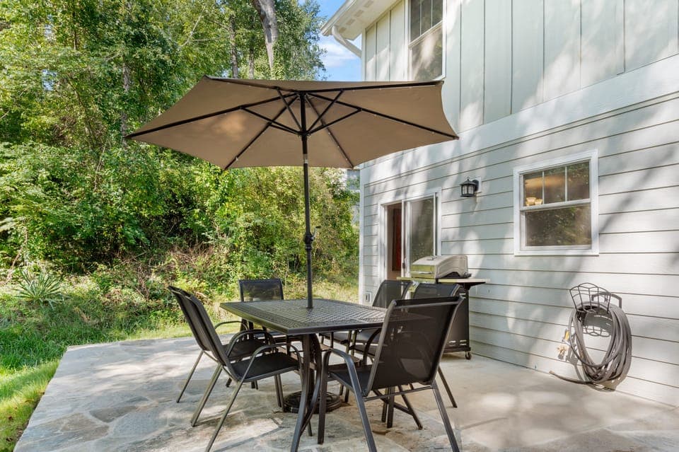 Patio with an al fresco dining area and BBQ grill. (Cherry Blossom)