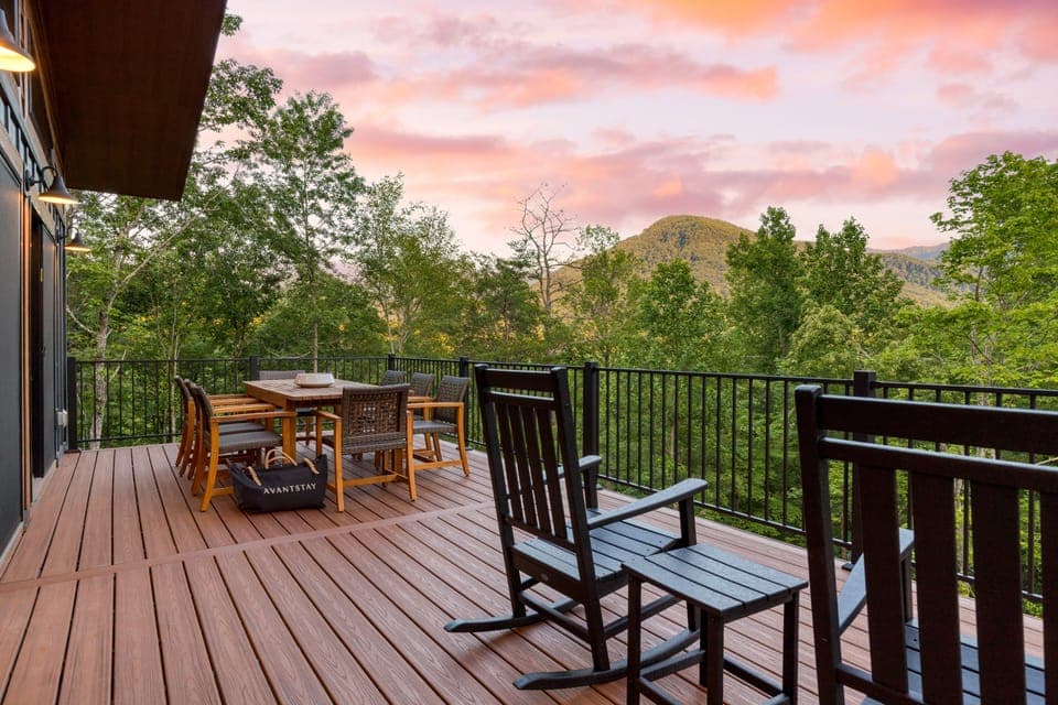 Outdoor dining area with sunset backdrop.