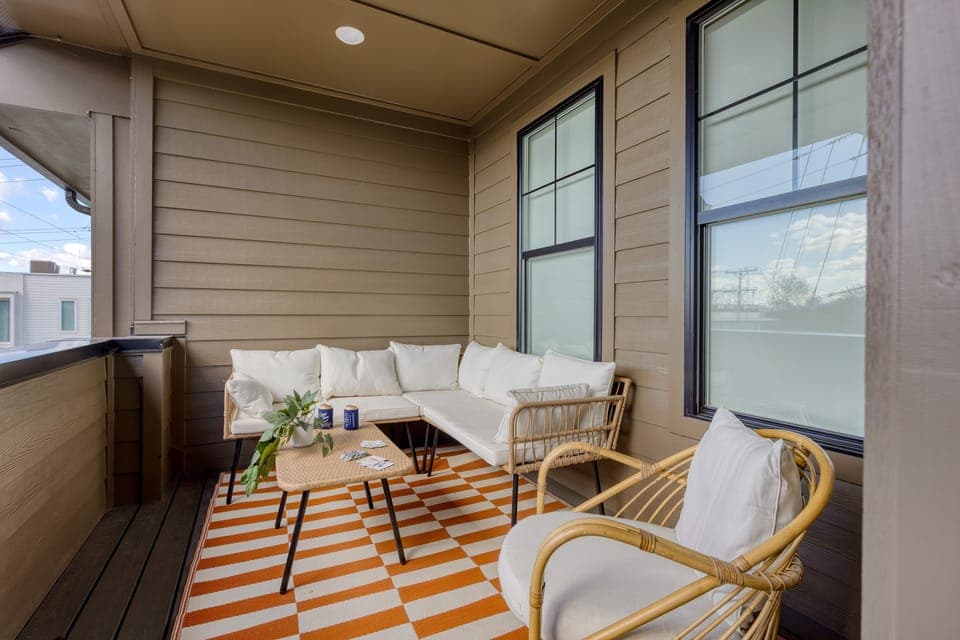 Outdoor living on the covered balcony. (Lischey)