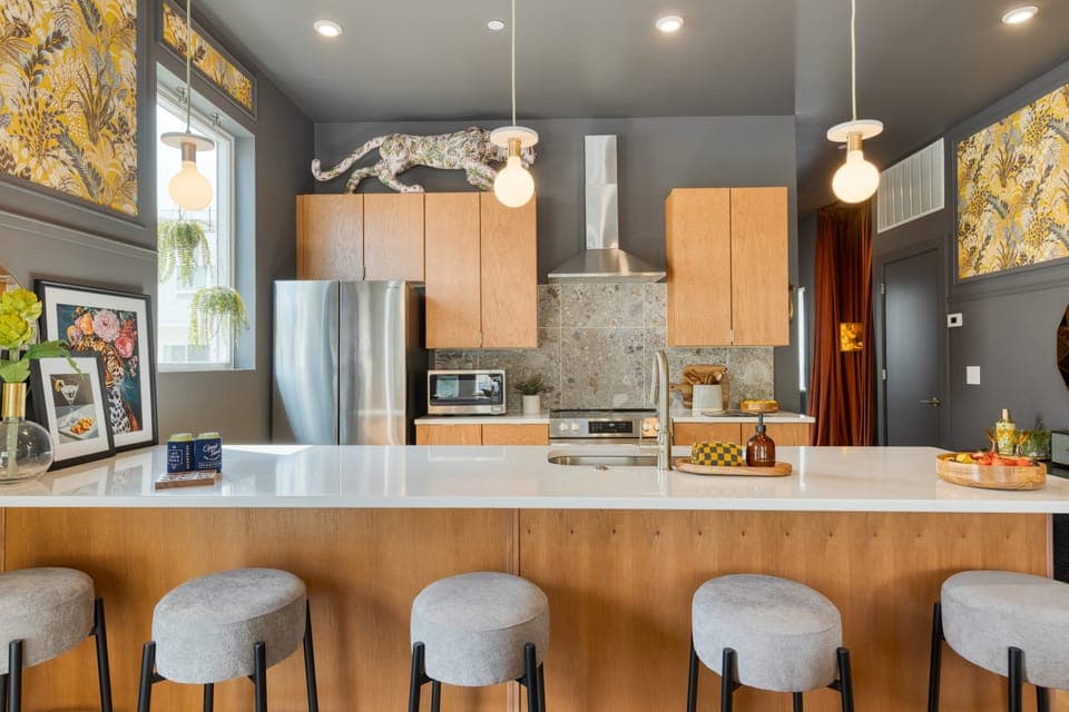 Sleek, modern kitchen with barstool seating.