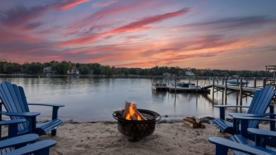 Lakefront fire pit area invites you to unwind.
