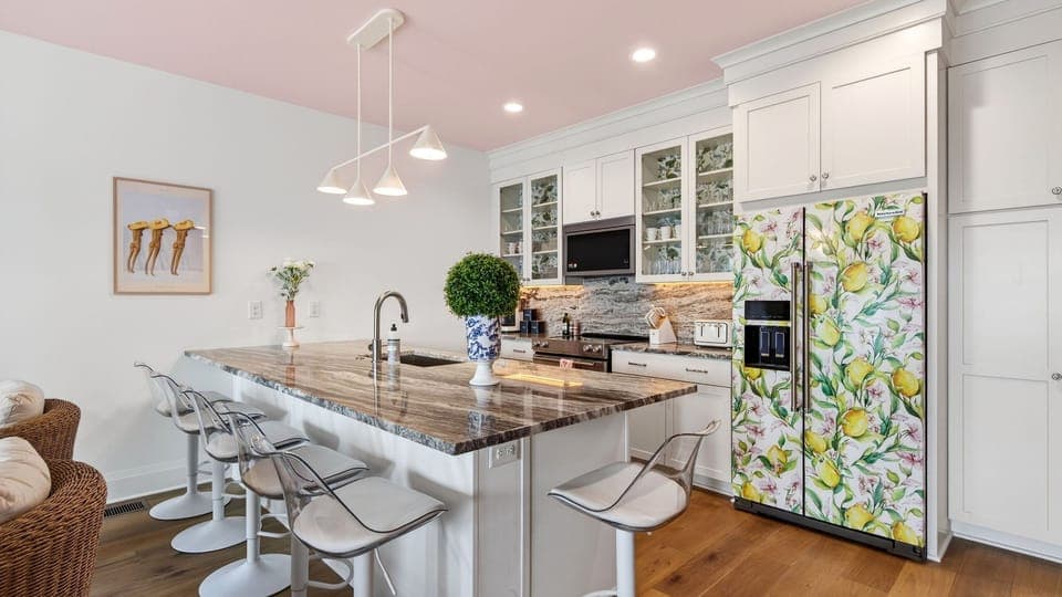 Fully equipped kitchen with island seating and standout design details. (Girls Night Out)