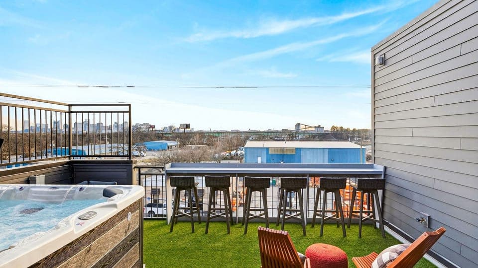 Sip, soak, and skyline-gaze—rooftop hot tub + bar seating for sunset hangs.