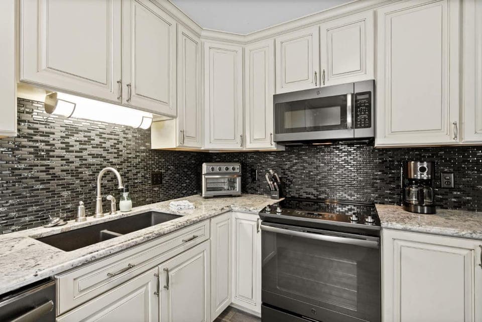 Kitchen or kitchenette, dishwasher, oven, stove, toaster