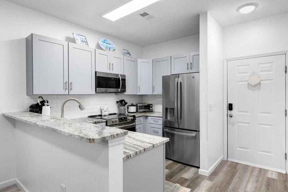 Kitchen or kitchenette, dishwasher, oven, stove, toaster