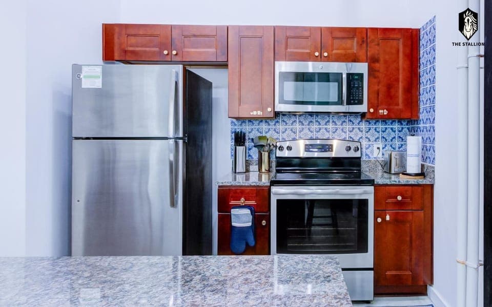 Kitchen or kitchenette, dishwasher, oven, stove, toaster