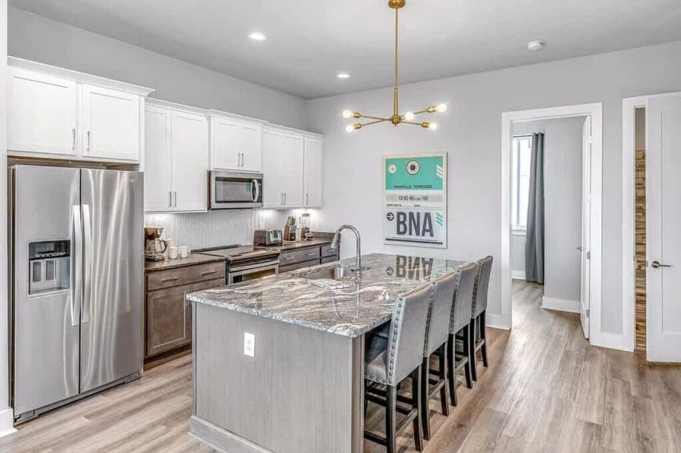 Kitchen or kitchenette, dishwasher, microwave, oven, stove