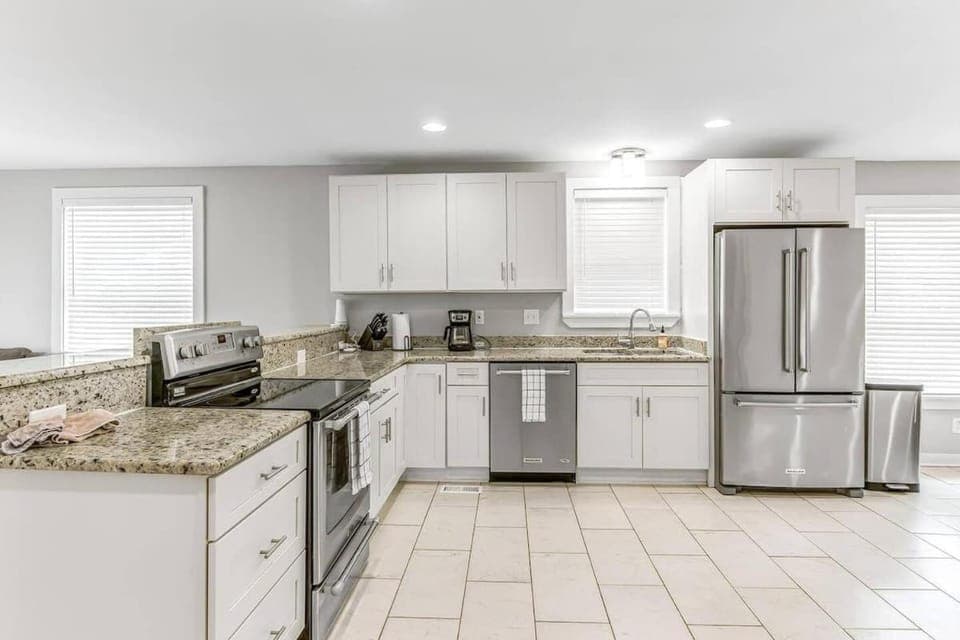 Kitchen or kitchenette, dishwasher, oven, stove