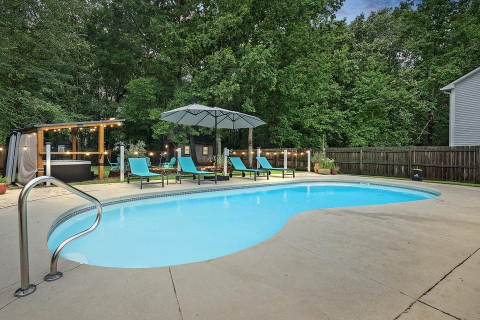 Property building, Patio, Spring, Day, View (from property/room), Pool view, Swimming pool, sunbed