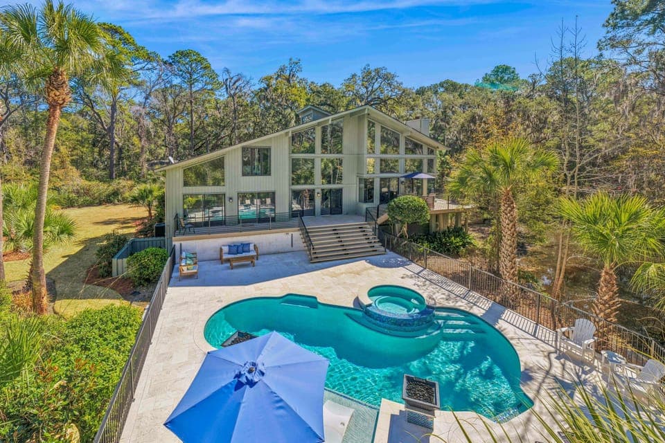 Discover the heart of this beautiful home—a newly renovated stone-paved pool deck featuring a unique saltwater pool and spa.