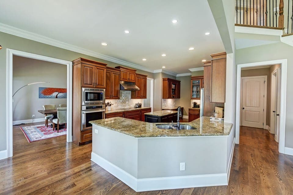 Modern kitchen with center island for chef's convenience.