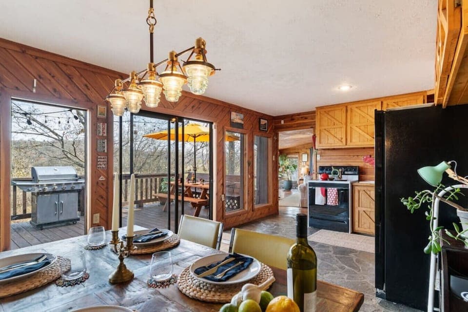 Quaint dining area with seating for four, overlooking the patio & Buffalo River