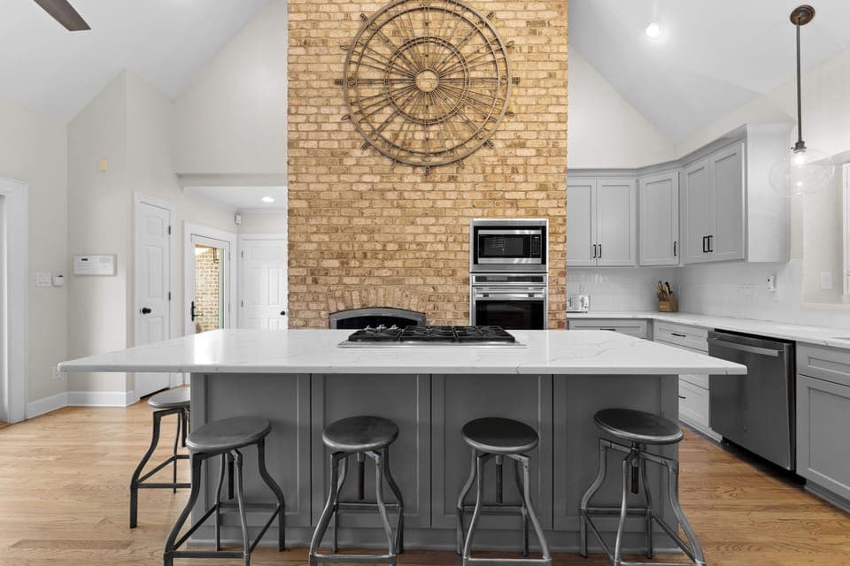 Large fully stocked kitchen with island seating for 4. 