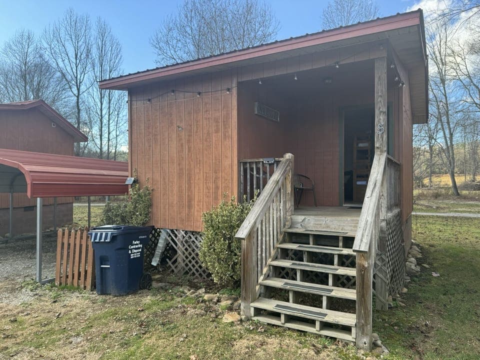 Each Cabin offers an inviting front porch with seating to enjoy the view