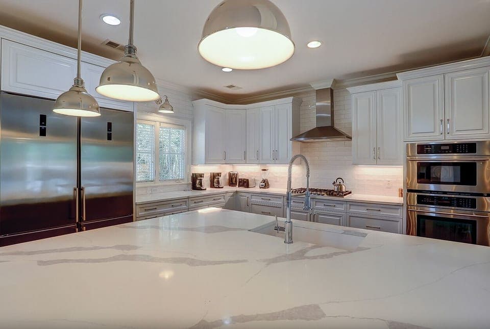 Kitchen with double refrigerator/freezers