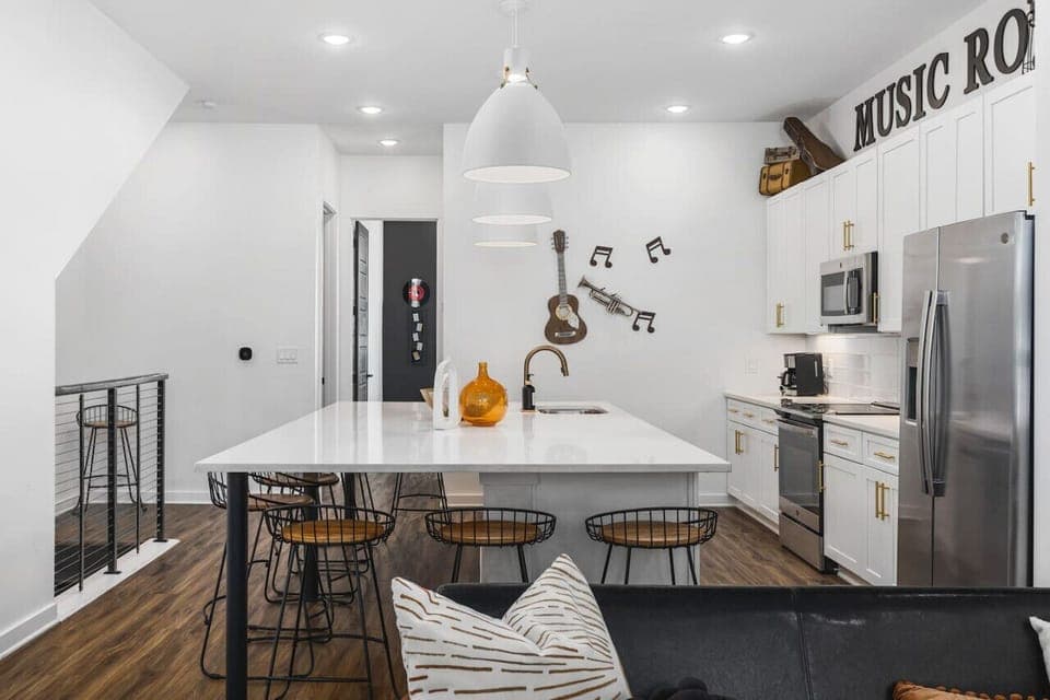 Massive kitchen on the main level with a coffee machine, wine cooler, and all the other kitchen essentials you'll need to cook & make yourself at home.