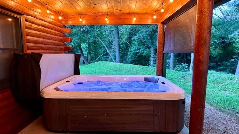 Private Hot tub on side covered deck with privacy fence