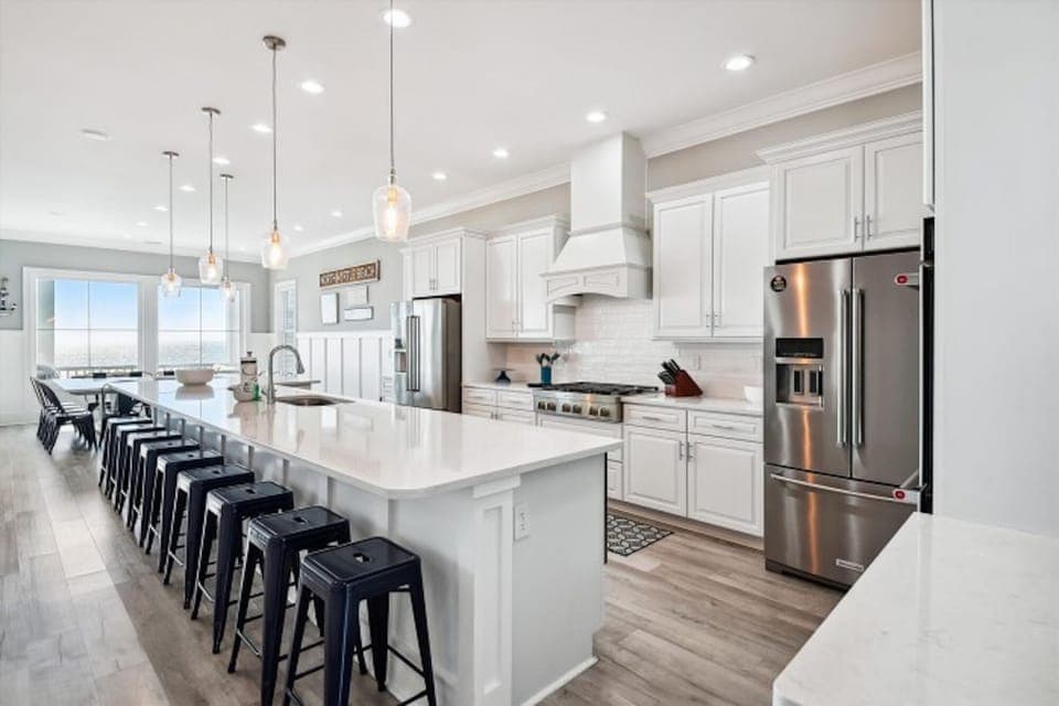 The kitchen island provides additional counter space for serving snacks or meals