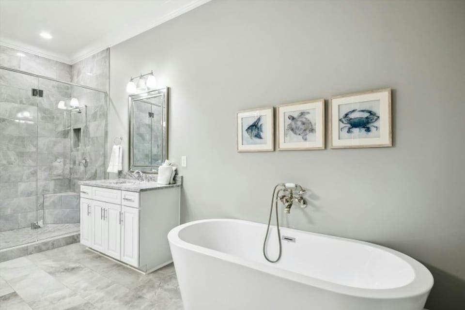 After a fun day on the beach, sink into the soaker tub with a glass of wine.