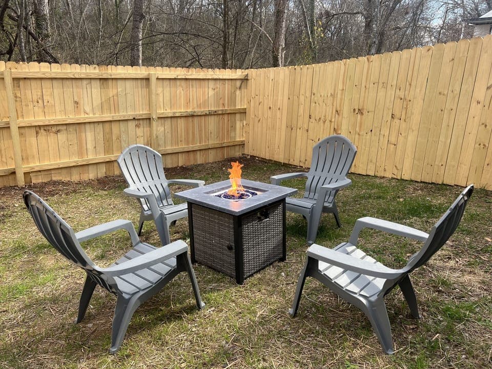 Private fully fenced yard area with fire pit, enjoy a cozy night with friends.