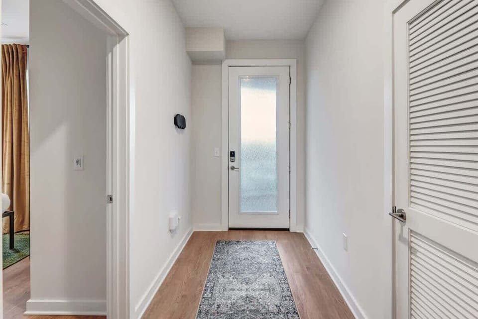 Step into a welcoming entryway that sets the tone for your stay, with clean lines and a stylish touch.