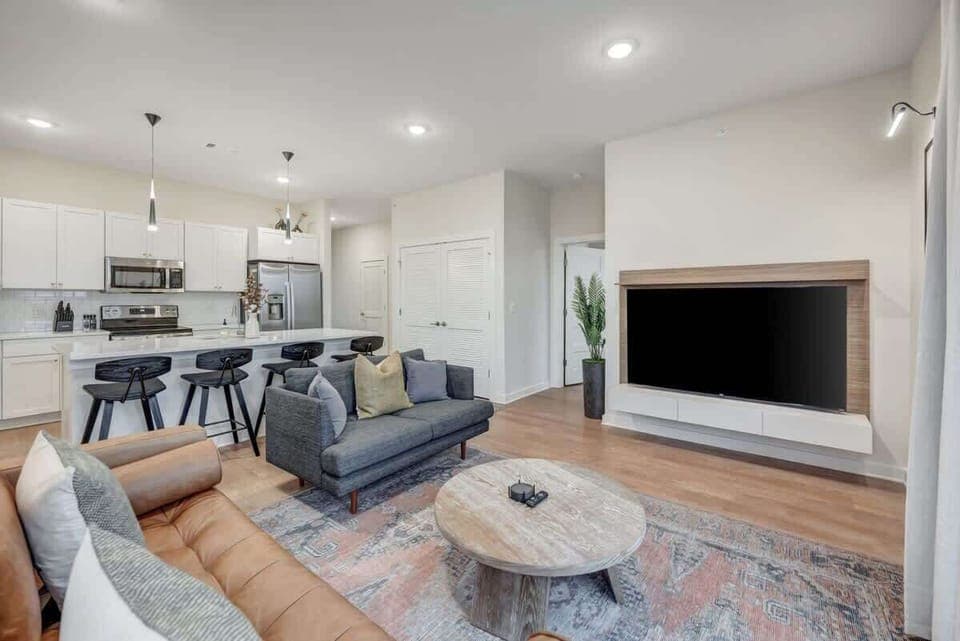 Immerse yourself in the ambiance of our sunlit open floor plan, where culinary spaces seamlessly blend with chic living areas.