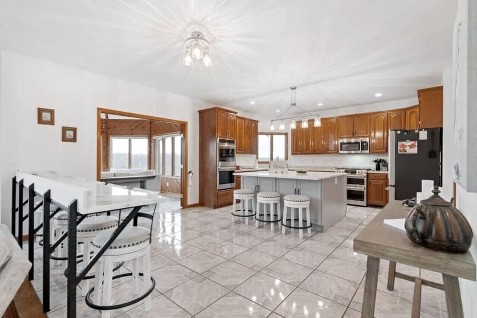 Kitchen, bar sitting area, and the entrance to one of the 180 degree panoramic view rooms