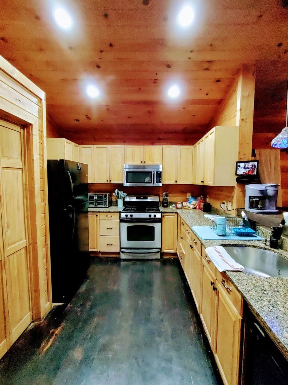 Full kitchen’s got everything but the groceries. Keurig, air fryer, toaster, and plenty of space