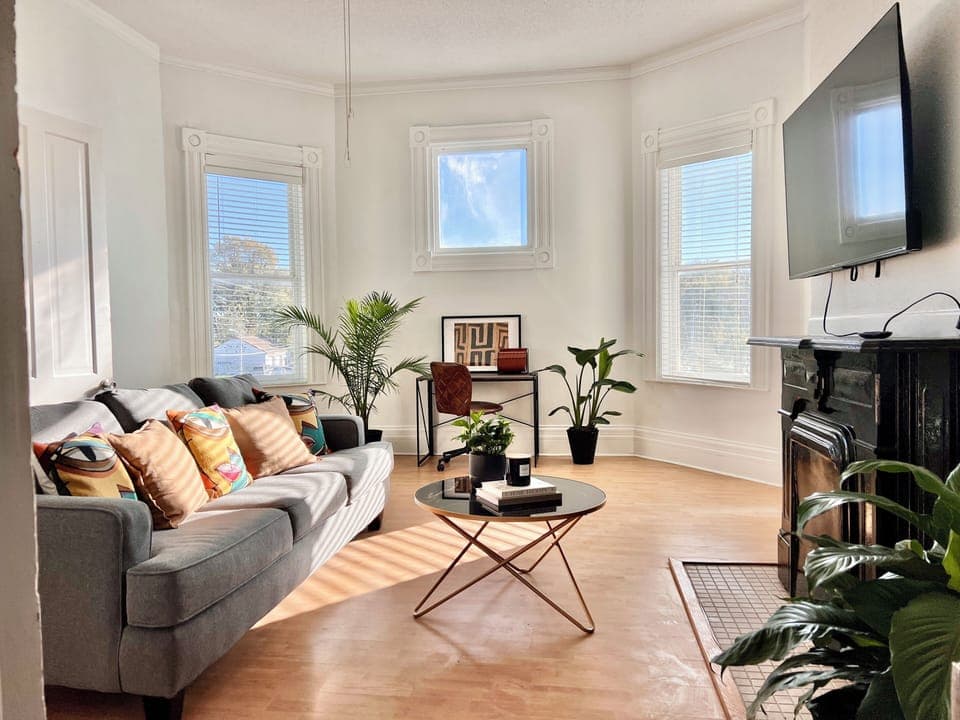 Living room with pullout sofa and workspace. 