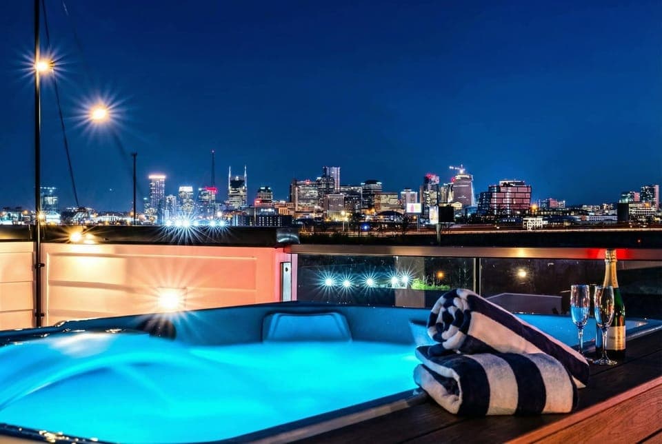 Immerse yourself in luxury at this Nashville Oasis featuring a stunning rooftop hot tub with city skyline views! Perfect for a Nashville Bachelorette getaway or a chic corporate retreat. Book now with Misfit Homes for the ultimate experience.