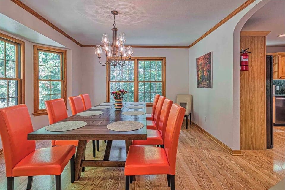 Huge dining area with bay window overlooking private woods