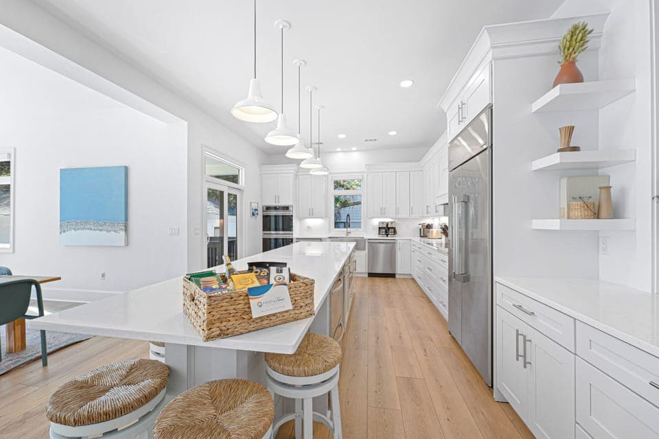 Kitchen and Dining:  Dining table seats 8, Breakfast table seats 3, Island bar with a seating for 8