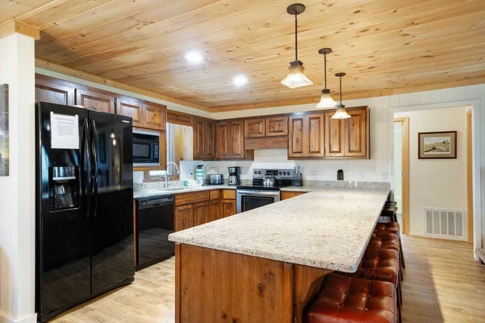 Granite Countertops and Large Bar with Seating