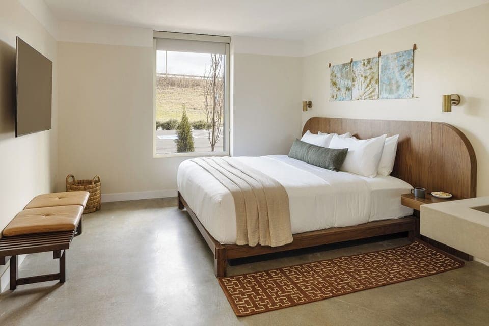 Settle in with plush bedding and a serene, minimalist vibe.