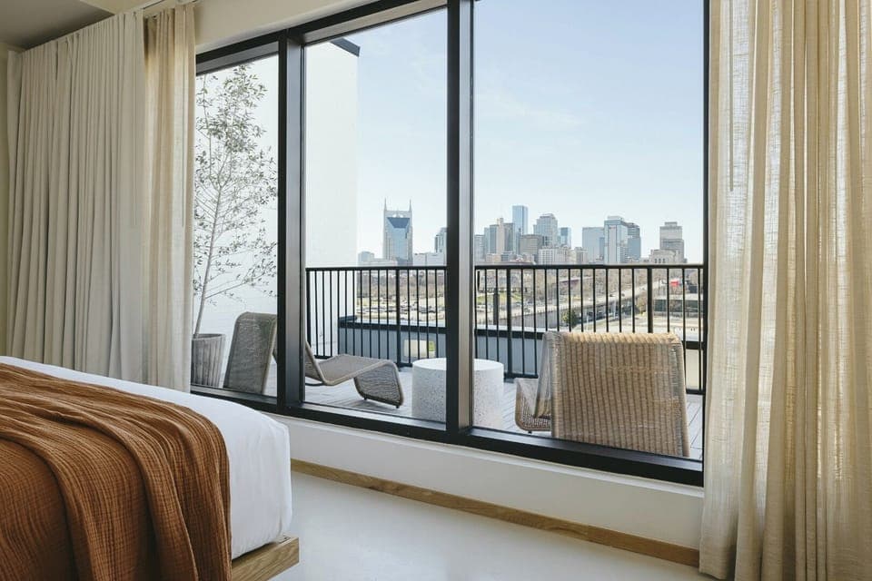 Sip morning coffee while the skyline unfolds beyond your balcony.