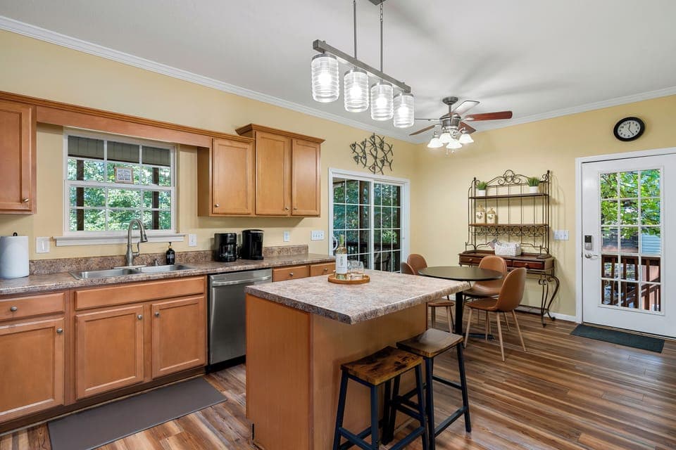 Sliding doors offer direct access to screen porch from fully equipped kitchen.