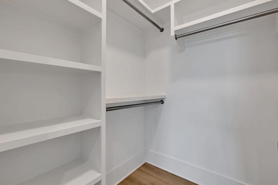 Unit 1 - 3rd Floor: Primary Bedroom featuring a luxurious King bed with a Smart TV, a walk-in closet and an ensuite Primary Bathroom.