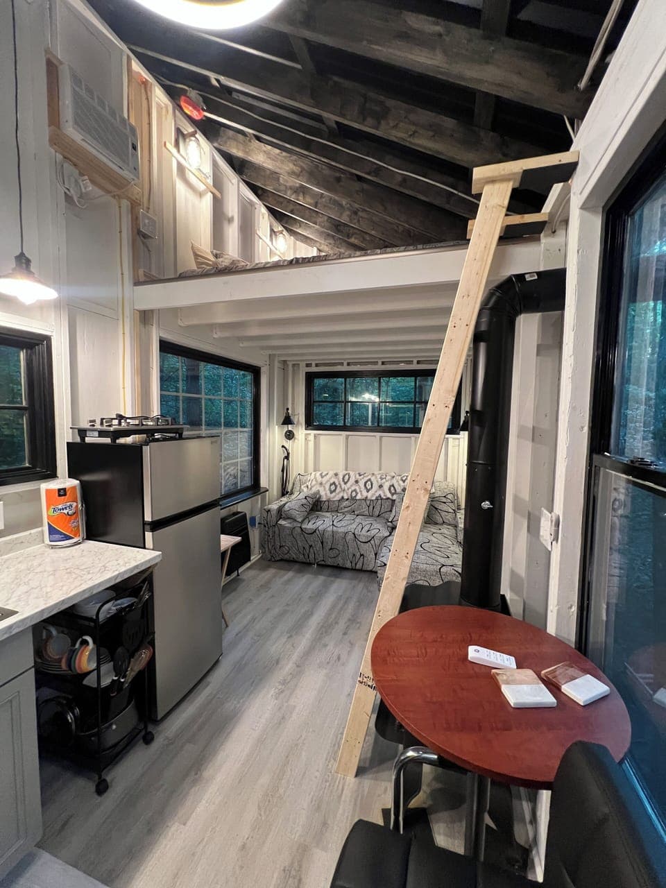 Bar seating with small frig. in kitchen area
